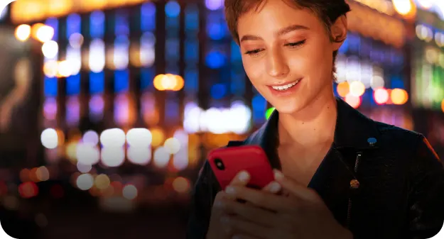 A teenager looking into his phone
